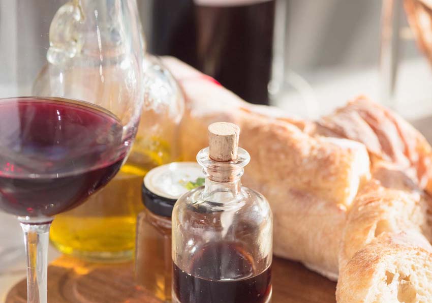 Photo of wine bottle, oil bottle, wine glass